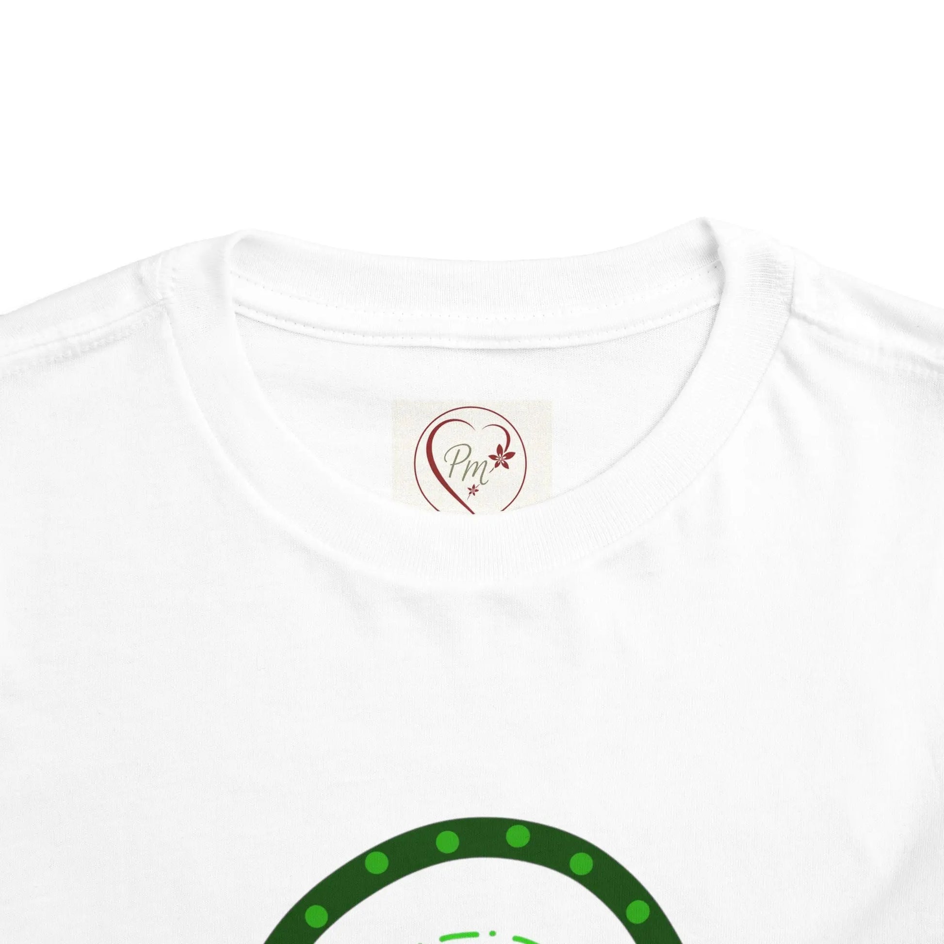White t-shirt with a green design on a white background featuring a PM Creations 25 Logo