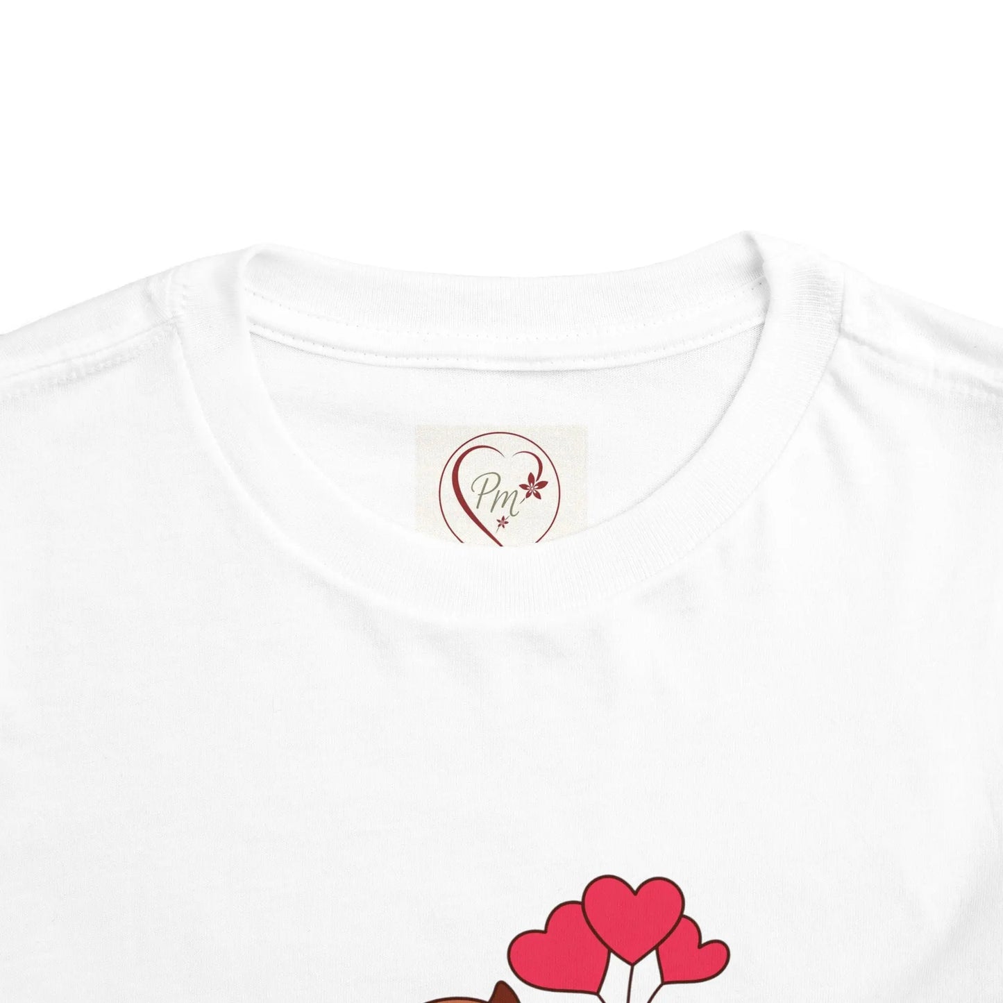White t-shirt with a heart design and PM Creations 25 logo on a white background