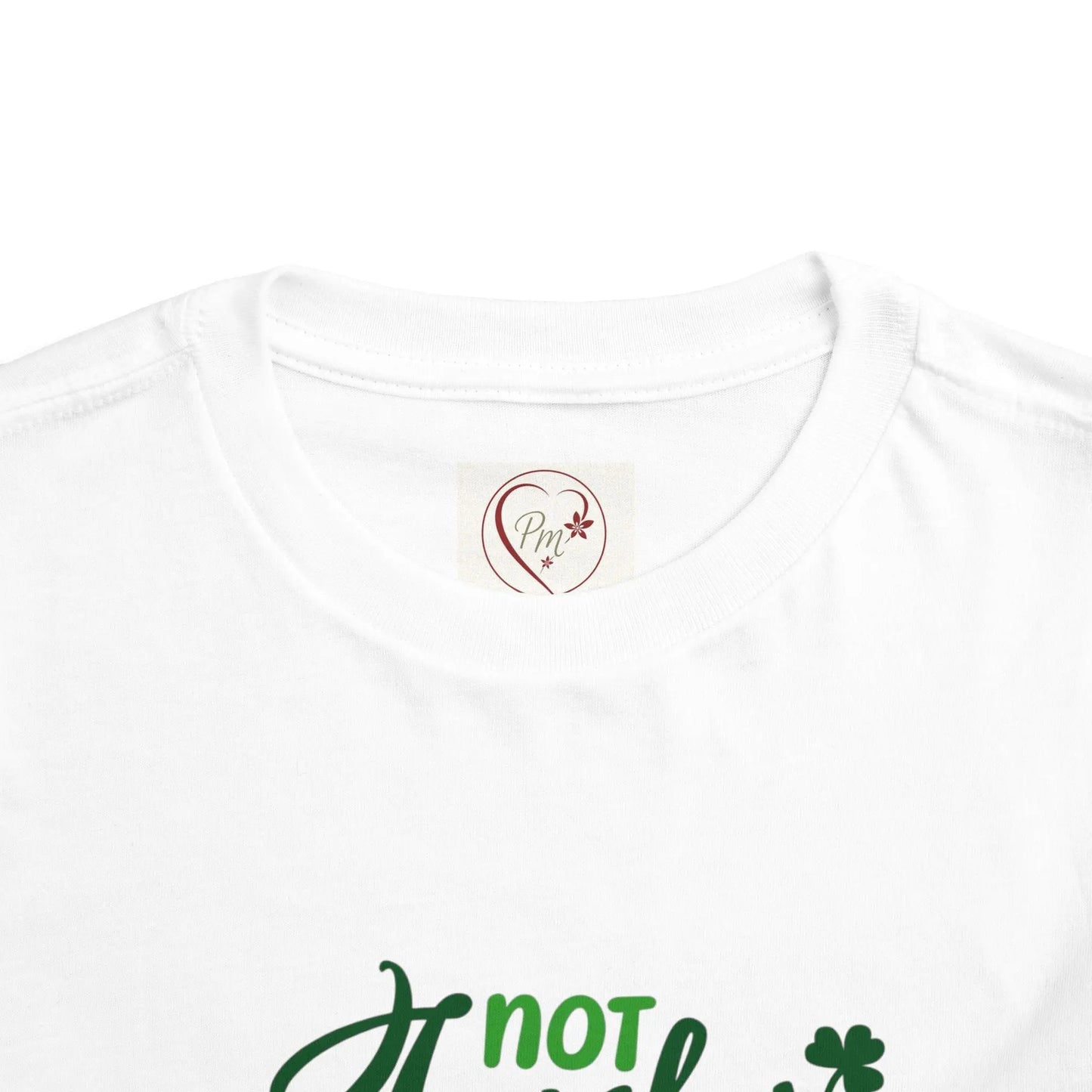 White t-shirt with green text and a PM Creations 25 logo on a white background