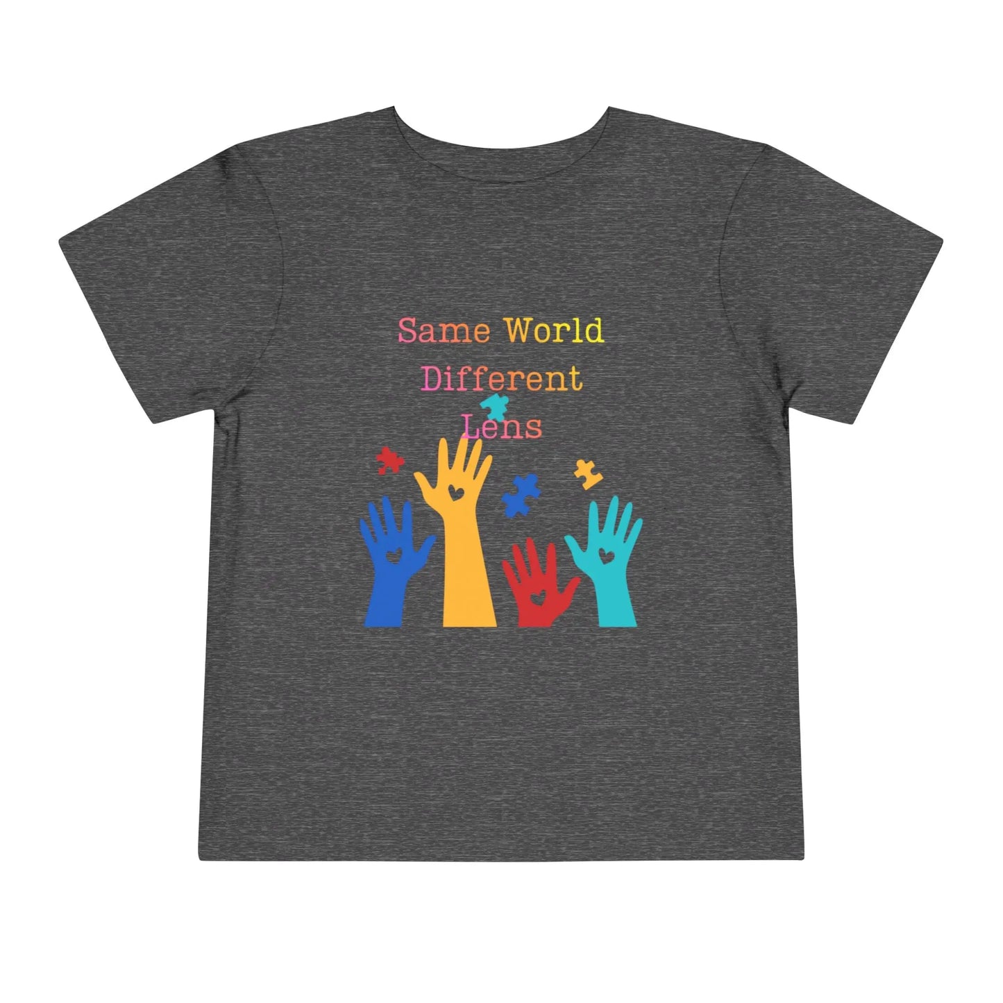 Soft cotton toddler tee with colorful hands, puzzle pieces, and Built Differently message. Celebrates neurodiversity and inclusion. Sizes 2T-5T. Dark Heather Grey
