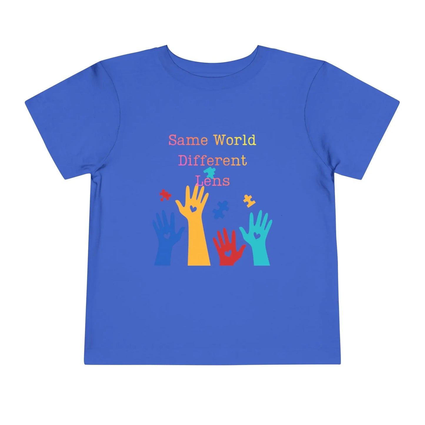 Soft cotton toddler tee with colorful hands, puzzle pieces, and Built Differently message. Celebrates neurodiversity and inclusion. Sizes 2T-5T. True Royal
