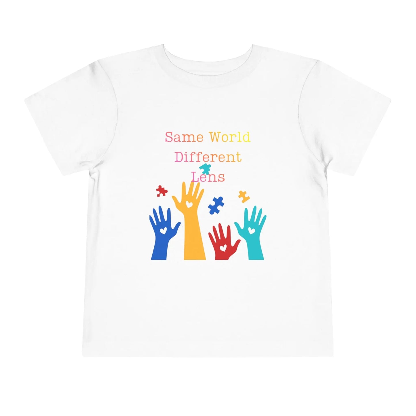 Soft cotton toddler tee with colorful hands, puzzle pieces, and Built Differently message. Celebrates neurodiversity and inclusion. Sizes 2T-5T. White

