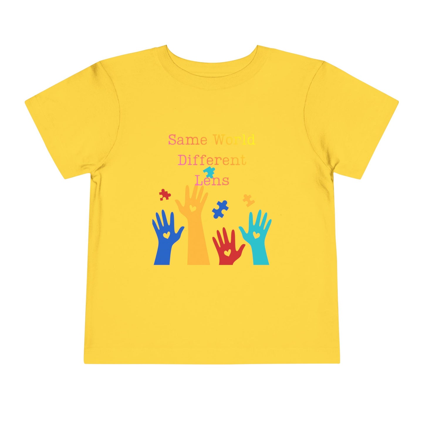 Soft cotton toddler tee with colorful hands, puzzle pieces, and Built Differently message. Celebrates neurodiversity and inclusion. Sizes 2T-5T. Yellow
