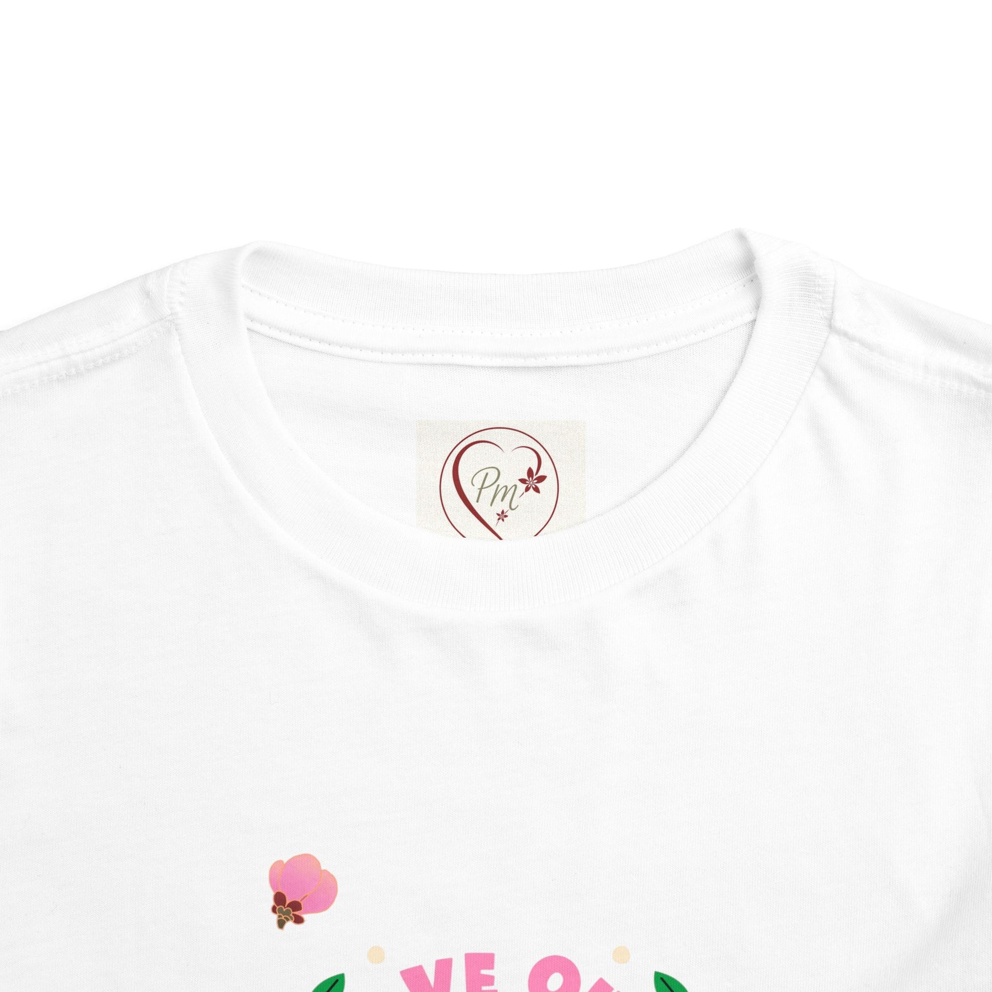 White t-shirt with a PM Creations 25 logo and text on a white background