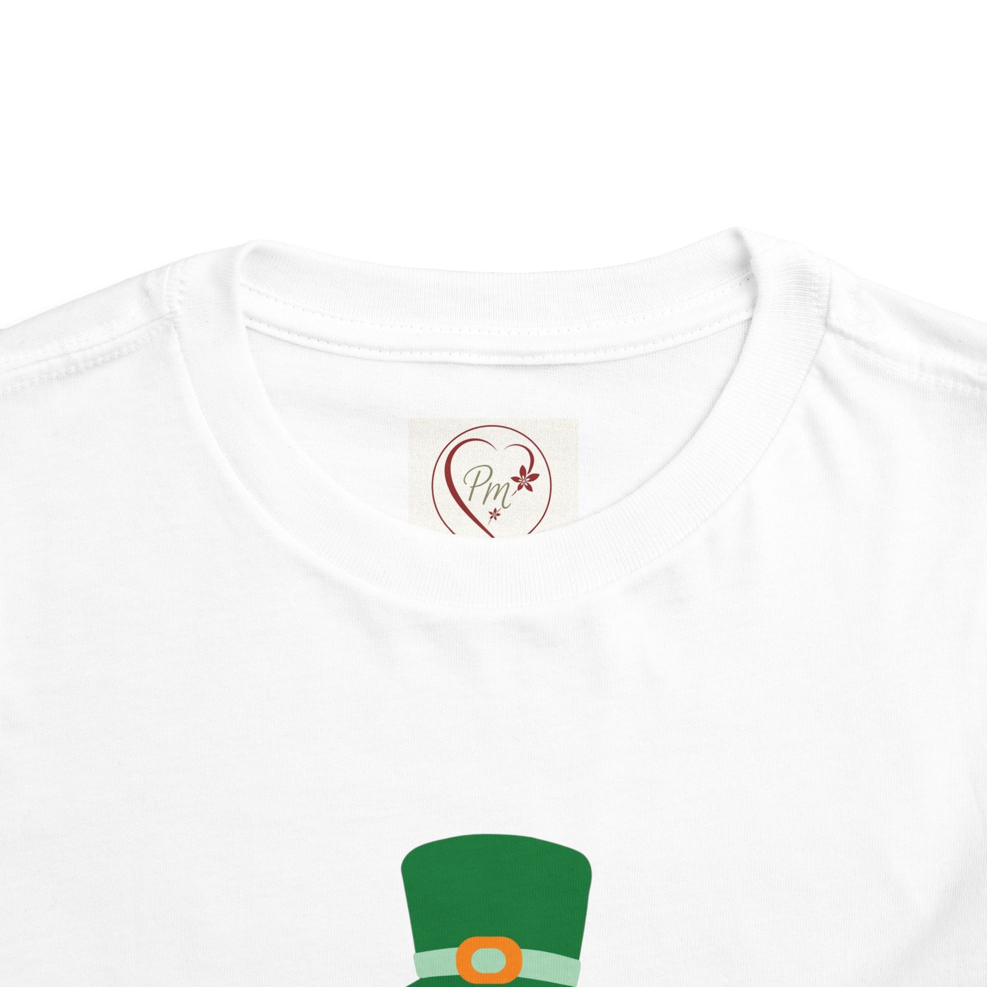 White t-shirt with green hat design and PM Creations 25 logo on a white background
