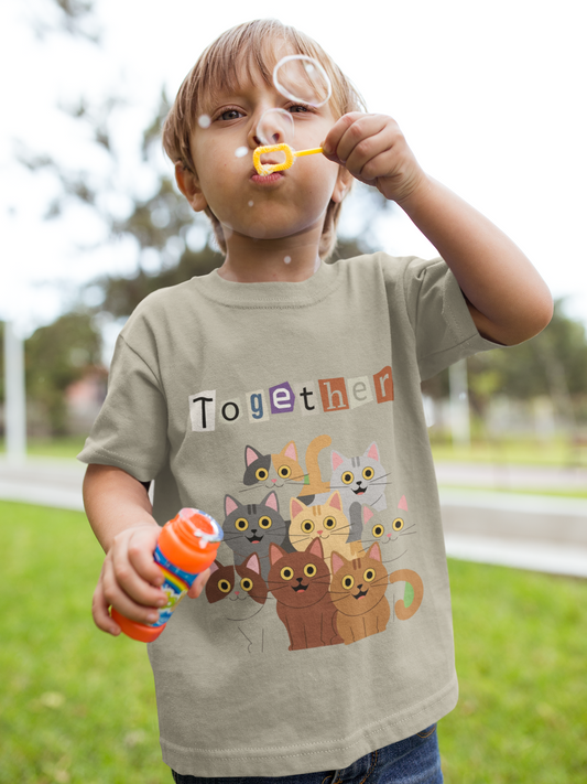 Toddler wearing Together tee with illustrated cats and colorful and "Together" message. Perfect for playdates, park trips, and everyday kindness. Sizes 2T-5T. Heather Stone