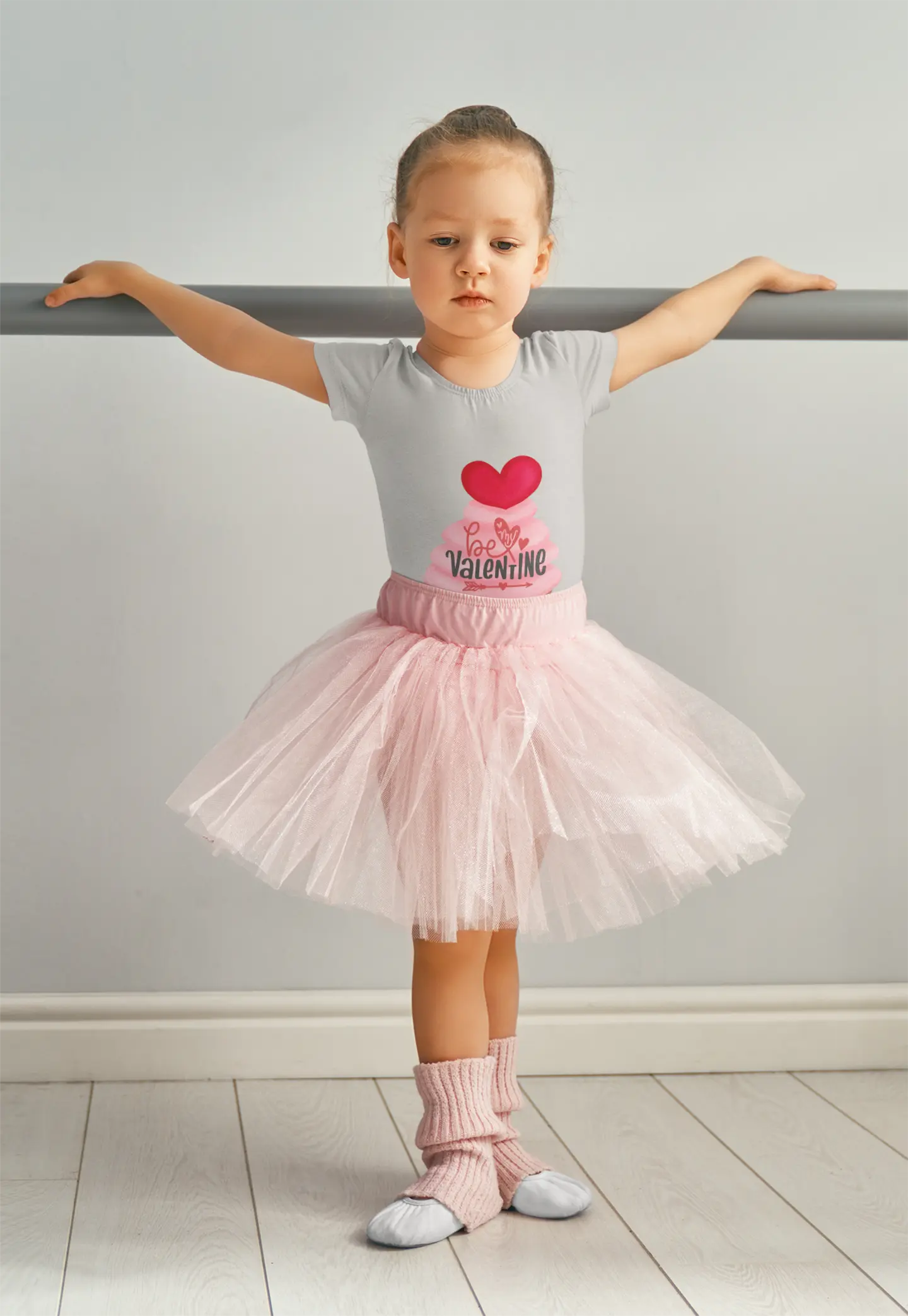 Toddler wearing Valentine's Day tee with pink cupcake and heart topper, Athletic Heather
