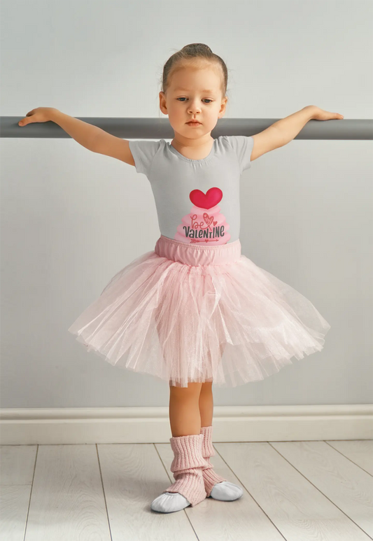 Toddler wearing Valentine's Day tee with pink cupcake and heart topper, Athletic Heather
