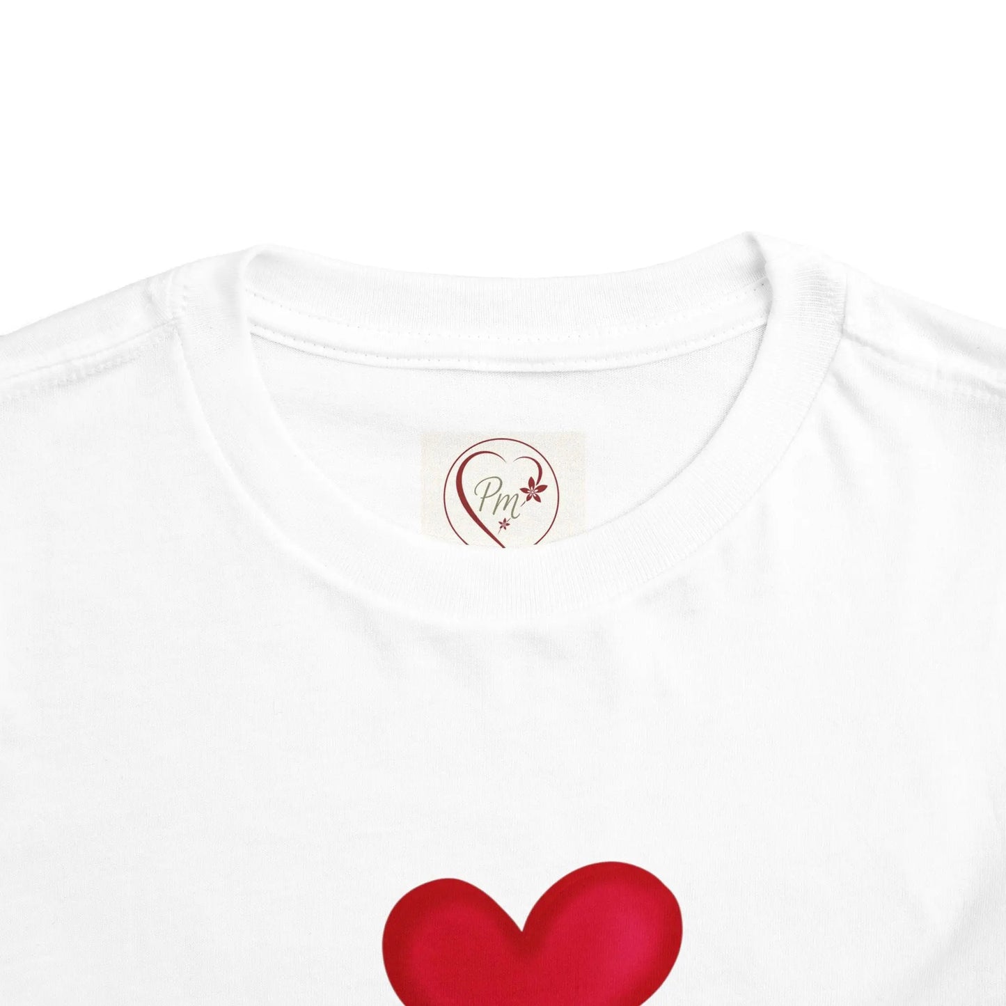 White t-shirt with a red heart design and a PM Creations 25 logo on the chest.