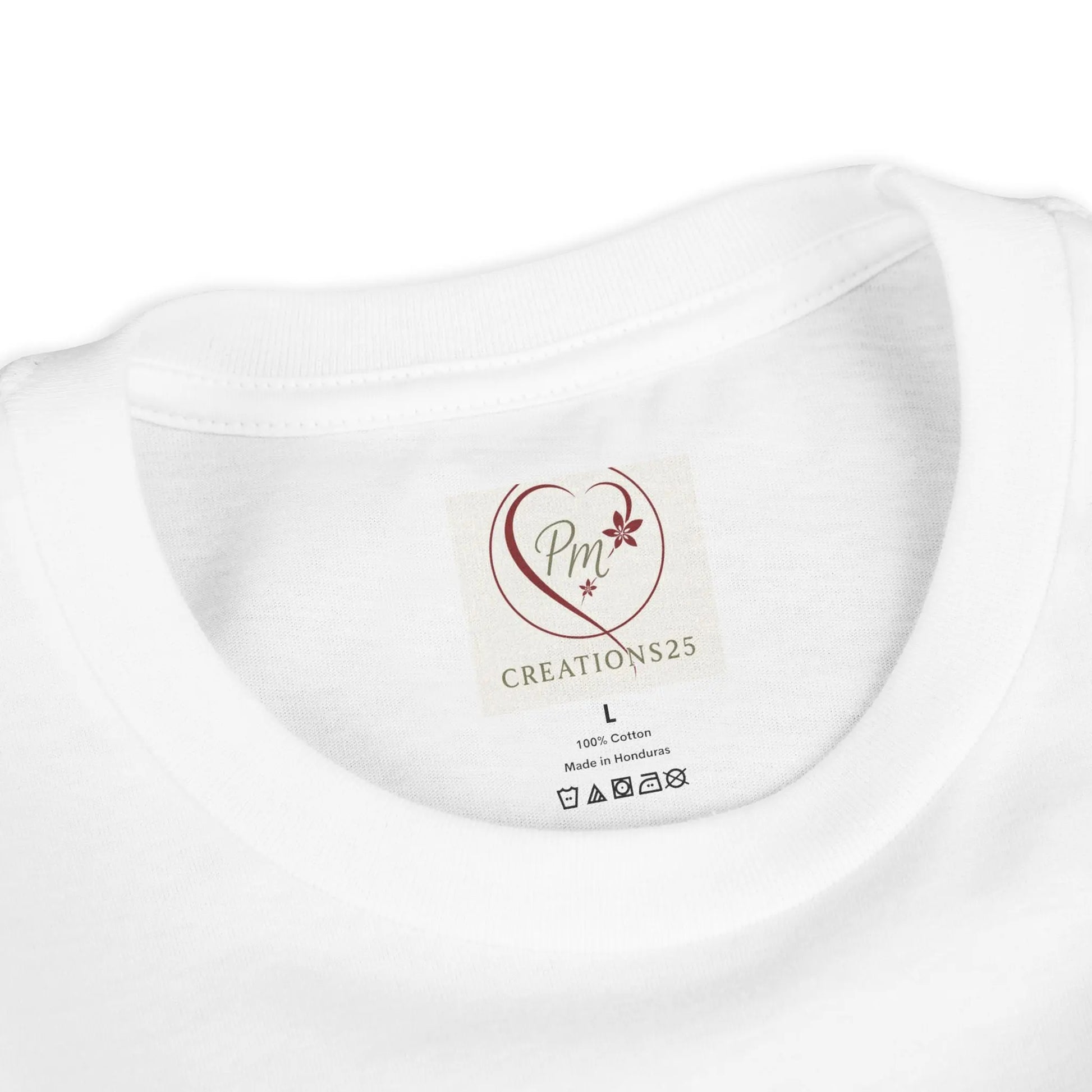 White t-shirt with a PM Creations 2 label on a white background