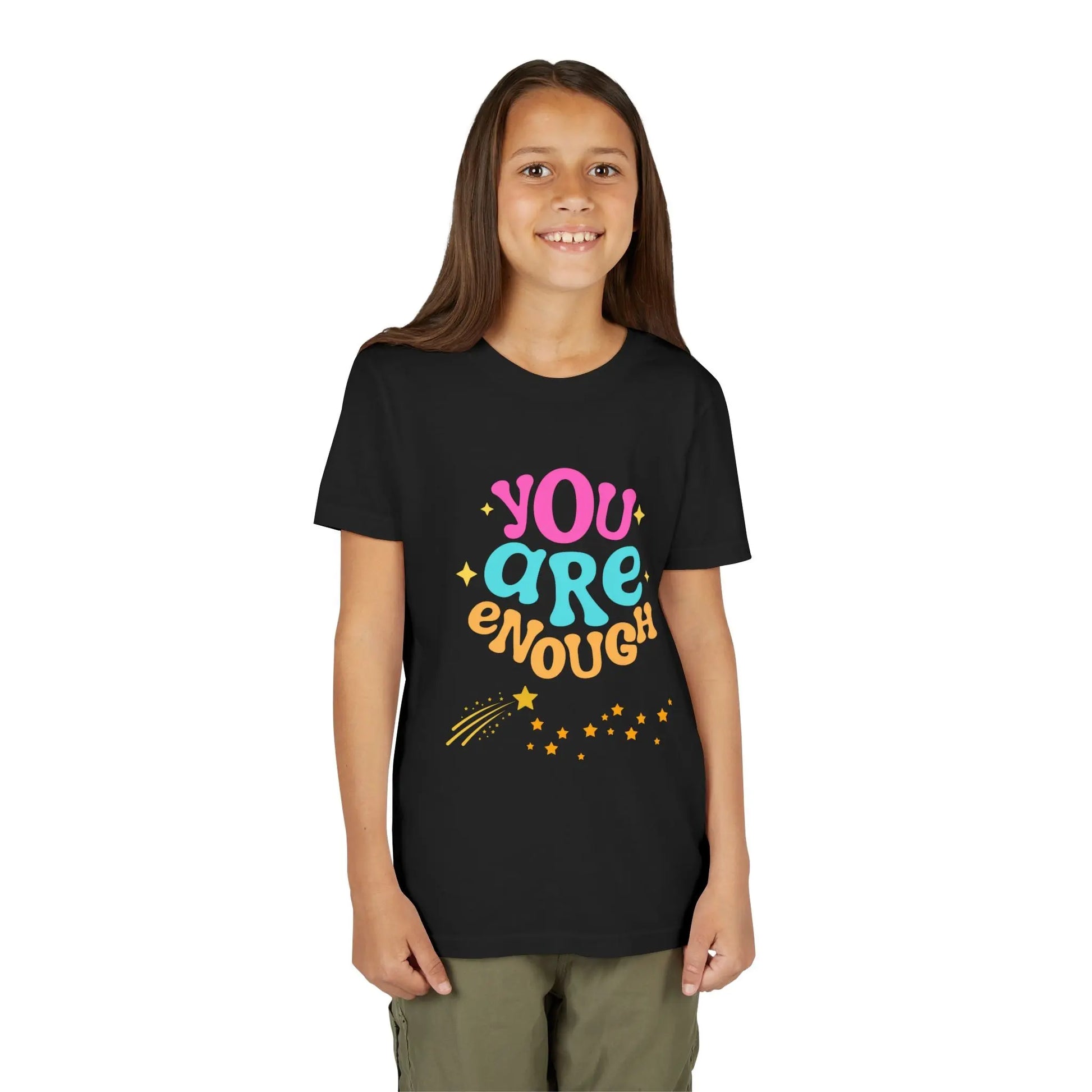 Youth Wearing a "You Are Enough" youth tee — a soft, uplifting kids shirt with a faith-inspired message of confidence, self-love, and kindness. Perfect for everyday wear. Shop the Collection, Black