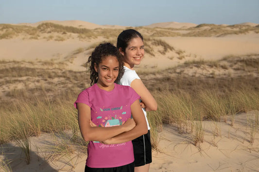Youth wearing Our Earth Our Home tee with green hill and house Earth Day design Berry
